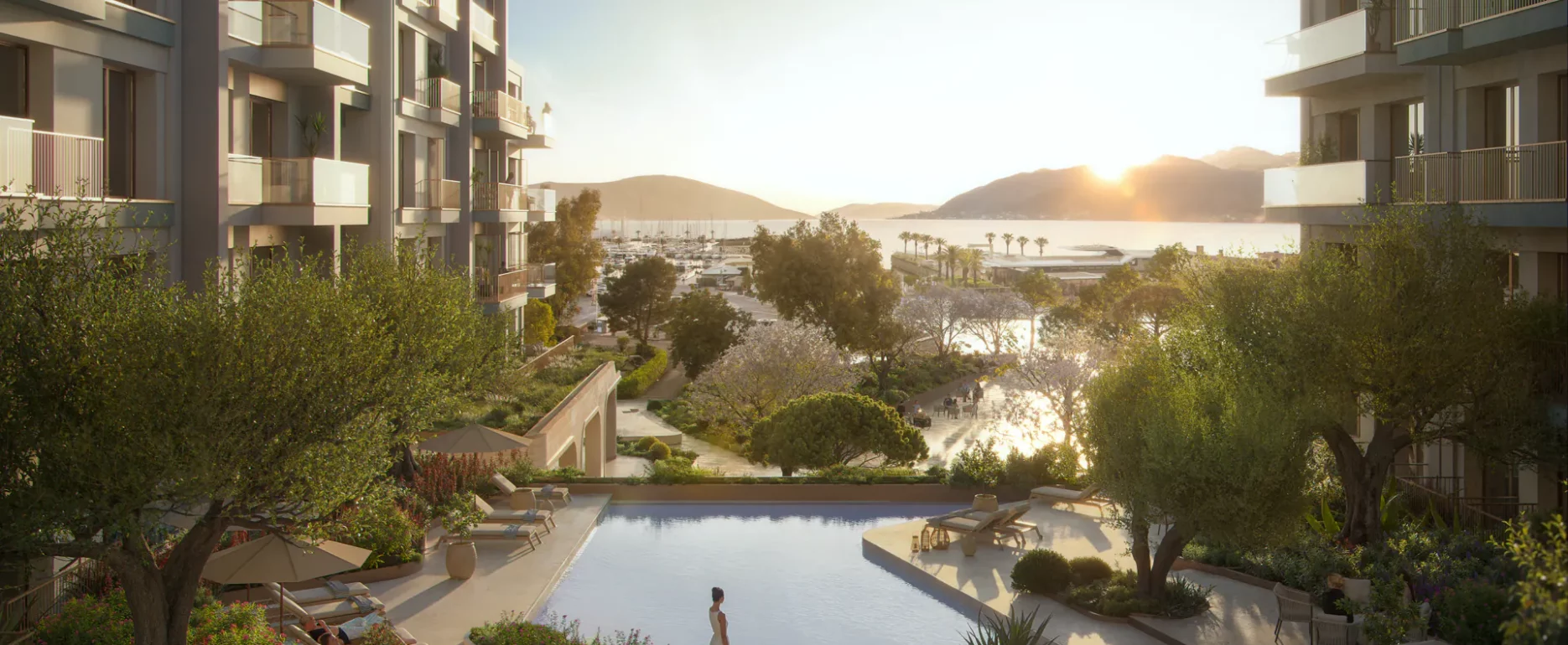 Moderne Apartmentanlage in Porto Montenegro mit Pool, Balkonen und Blick auf den Yachthafen Tivat bei Sonnenuntergang
